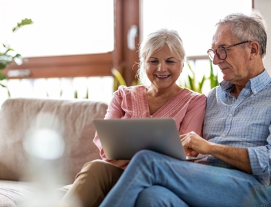 Older couple looking at a laptop